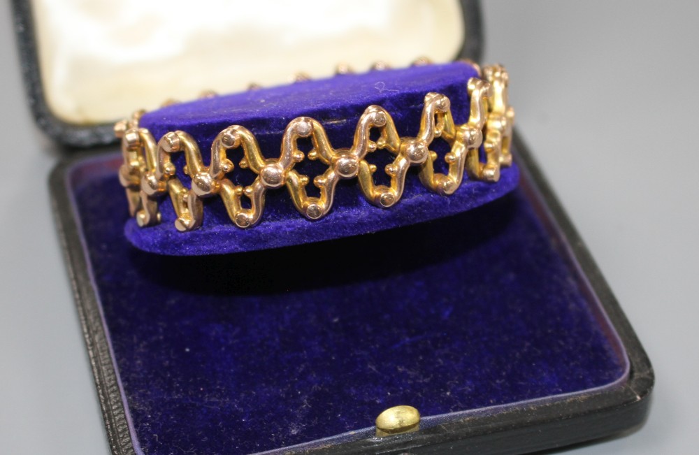 A late Victorian 9ct expanding bracelet, in original fitted box, weight 12.3 grams.